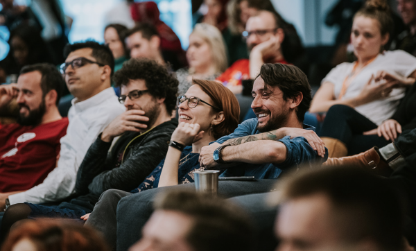 Five people watching a presentatiojn